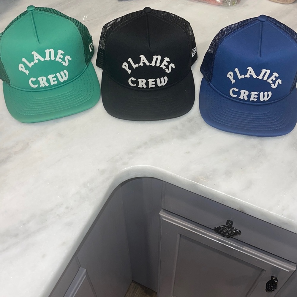 3 hats planes and papers